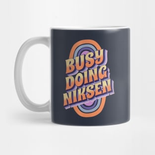 BUSY DOING NIKSEN Mug